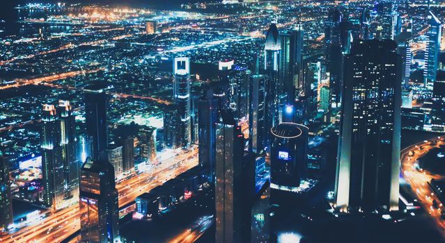 Aerial night view of Dubai in United Arab Emirates, metropolitan cityscape scenery