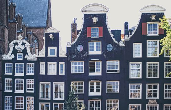 Main downtown street in the city center of Amsterdam in Netherlands on sunny day