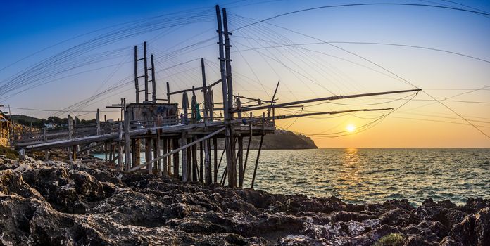 Sunset on Trabucco da Mimì, located along the coast of Puglia, Italy.