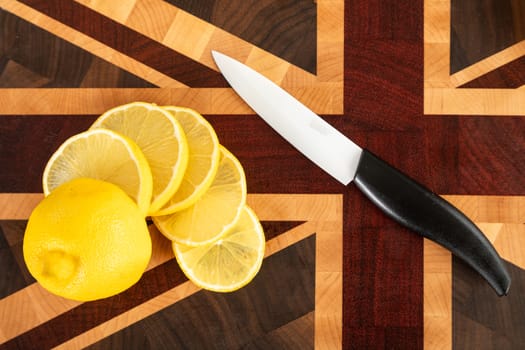 Still life with fruit. Sliced orange and other fruits on a wooden cutting board