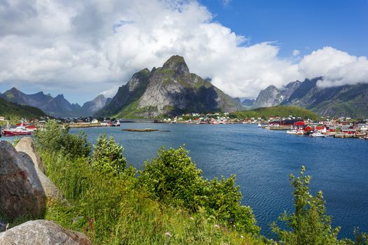 Beautiful scandinavian landscape with mountains and fjords. Panorama view of Reine village on Lofoten islands, Norway.