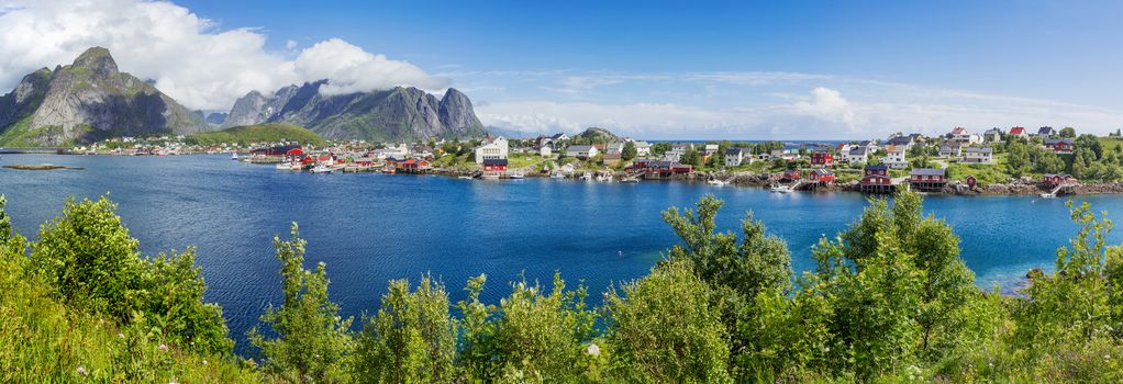 Beautiful scandinavian landscape with mountains and fjords. Panorama view of Reine village on Lofoten islands, Norway.