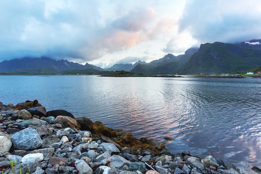 Beautiful sunset scandinavian landscape with village, mountains and fjords. Lofoten islands, Norway.