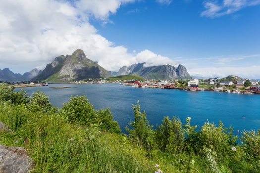 Beautiful scandinavian landscape with mountains and fjords. Panorama view of Reine village on Lofoten islands, Norway.