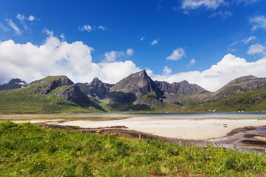 Beautiful scandinavian landscape with mountains and fjords. Car trip on Lofoten islands, Norway.
