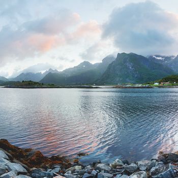 Beautiful sunset scandinavian landscape with village, mountains and fjords. Lofoten islands, Norway.