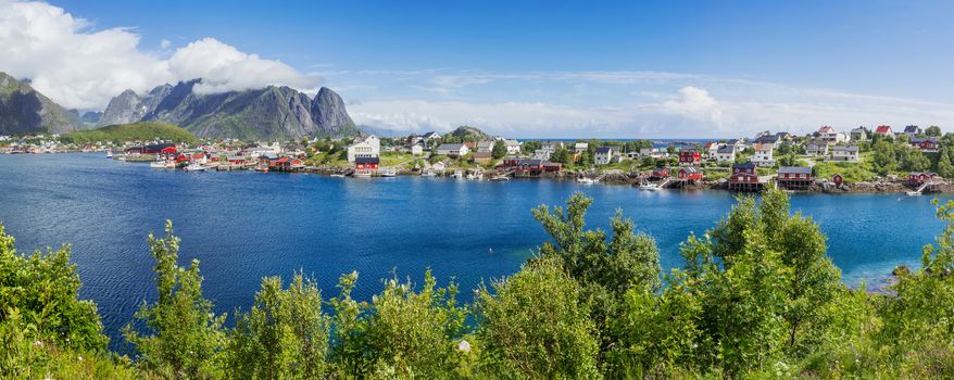 Beautiful scandinavian landscape with mountains and fjords. Panorama view of Reine village on Lofoten islands, Norway.