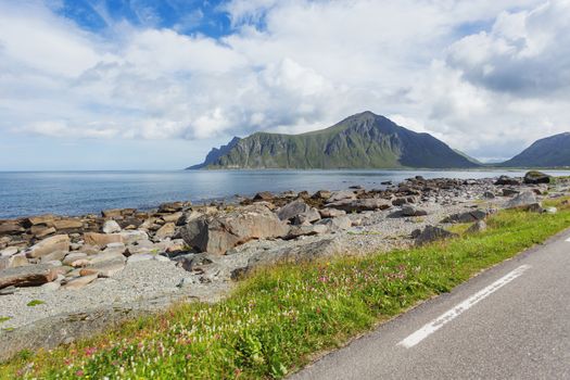 Beautiful scandinavian landscape with mountains and fjords. Car trip on Lofoten islands, Norway.