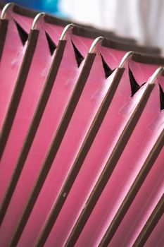 Bellows of an old accordion. Details of a vintage musical instrument, close-up view