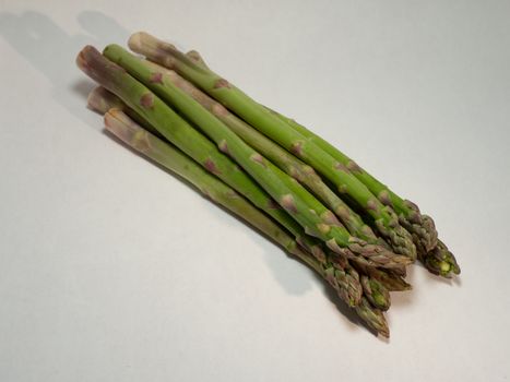 green asparagus on white background