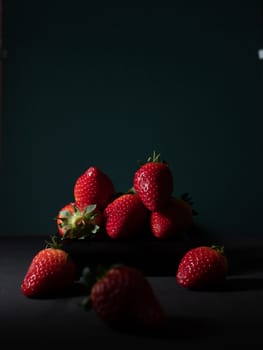 fresh strawberries on dark background