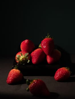 fresh strawberries on dark background