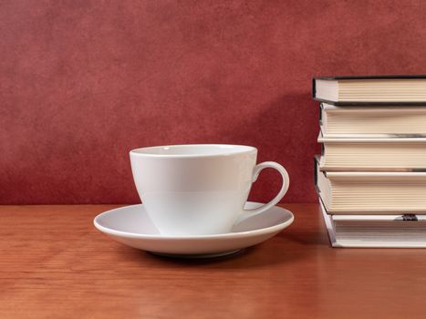 glasses and books on wooden table