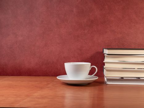 glasses and books on wooden table