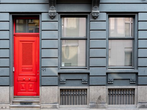 gray facade with red door