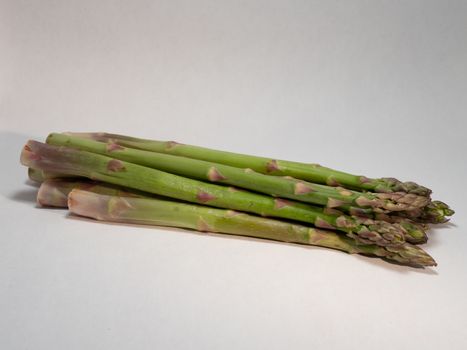 green asparagus on white background