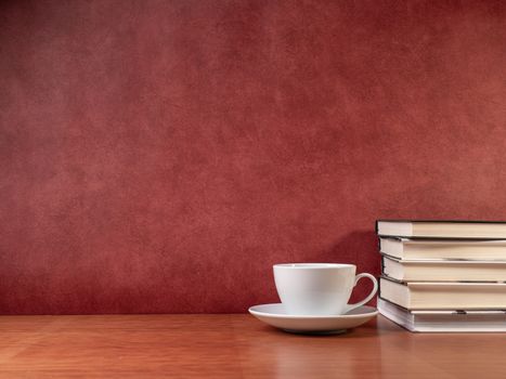 glasses and books on wooden table