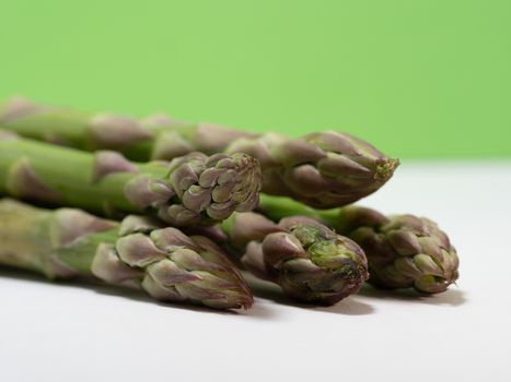 green asparagus on white background