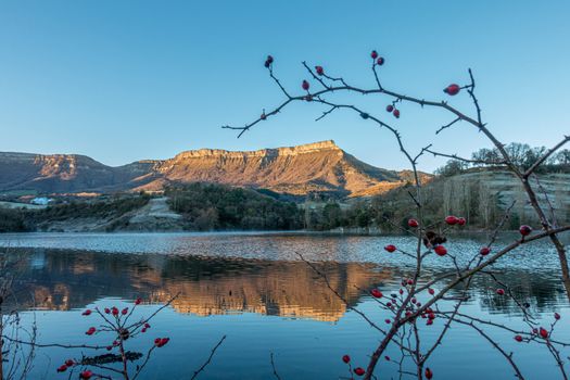 mountains at sunrise with reflection in the lake