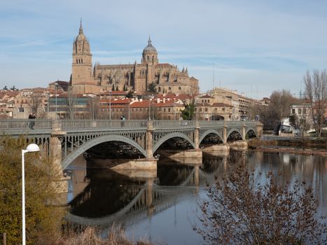 Salamanca cathedral with reflection on the river