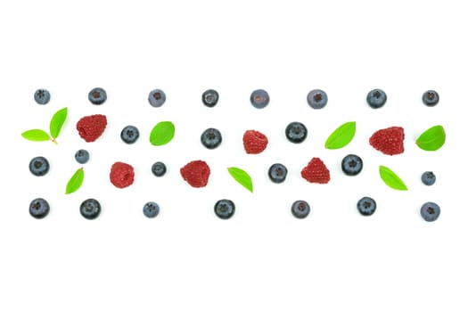 Top view of a forest fruits ornament with blueberry, leaves and a raspberry.