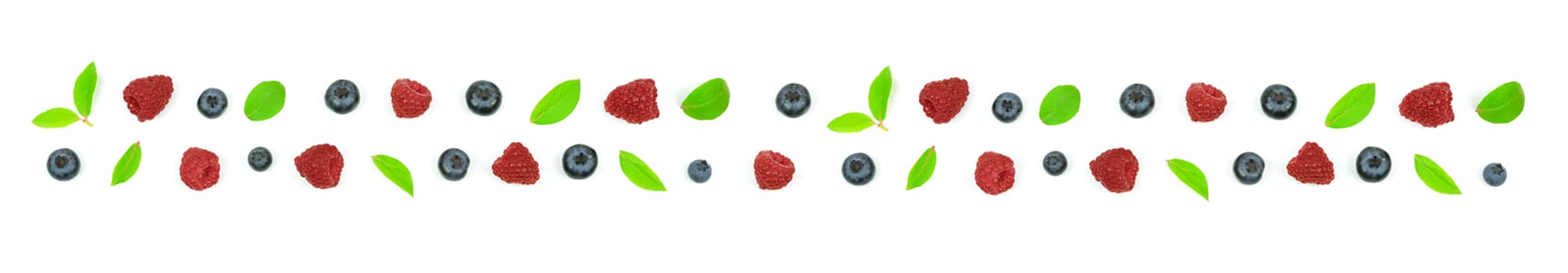 Top view of a forest fruits long ornament with blueberry, leaves and a raspberry.