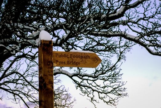 Trails signs on the snowy day in Cumbria