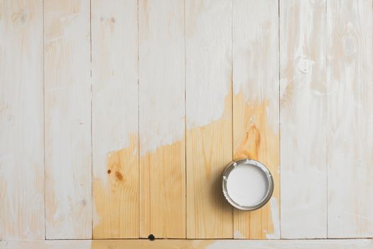 open cans of paint on a wooden background