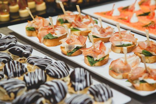 Tasty snacks with salted salmon and cottage cheese filling on plate