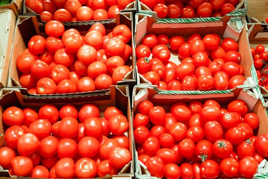 boxes with tomatoes in supermarket. Healthy Eating