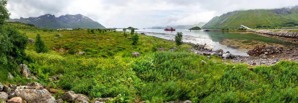 Beautiful scandinavian landscape with Atlantic Ocean Road (Atlanterhavsvegen), meadows, mountains and fjords. Lofoten islands, Norway.