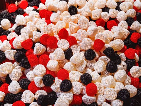Colorful gummy berries. Top view, flat lay. Background of delicious candies.