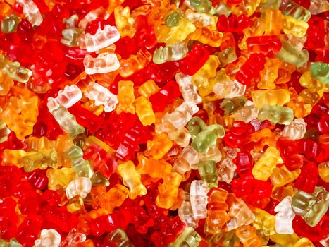 Colorful gummy bears. Top view, flat lay. Background of delicious candies.
