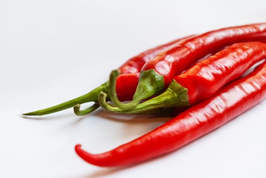 Chili pepper or chile on white background. Red fruits are used as a spice.
