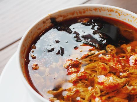 Asian cuisine - Kimchi soup in white bowl with rice. Close up photo.