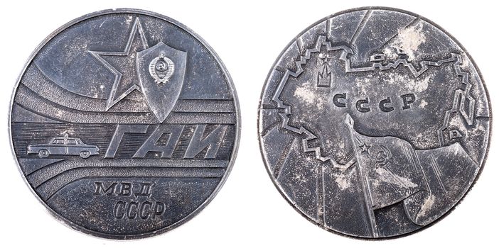 Medal of GAI (traffic police) of the Soviet Union.Metal token with police car and words GAI, MVD (Ministry of internal affairs), USSR.