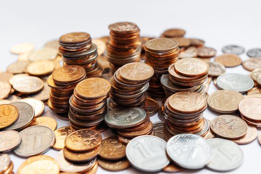 Big heap of columns of different Russian coins on white background.