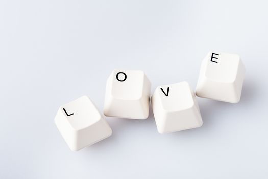 Word LOVE on computer keyboard's buttons. May be used as symbol of love on the Internet, love e-mail letters.