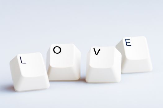 Word LOVE on computer keyboard's buttons. May be used as symbol of love on the Internet, love e-mail letters.