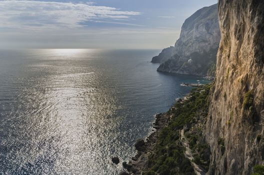 The immensity of the sea and the rocks in a sunset.