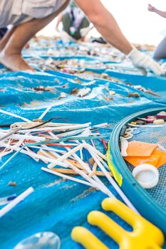 Beach Cleaning. Cleaning dirty beaches by the action of man. Sustainability of the planet and preservation of nature.