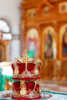 Bridal crowns. Sacral details of wedding ceremony in the Orthodox Christian Church. Russia.