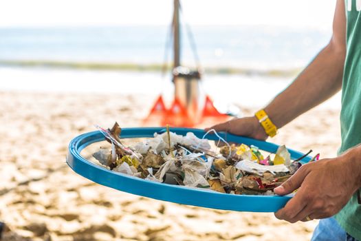 Beach Cleaning. Cleaning dirty beaches by the action of man. Sustainability of the planet and preservation of nature.