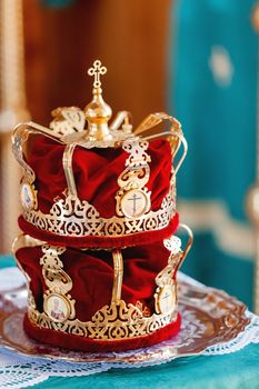 Bridal crowns. Sacral details of wedding ceremony in the Orthodox Christian Church. Russia.