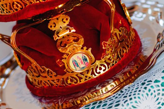 Bridal crowns. Sacral details of wedding ceremony in the Orthodox Christian Church. Russia.