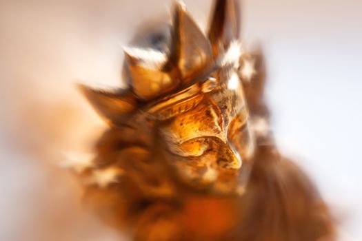 Close up photo of unknown goddess statue. Old rusty metal sculpture captured with Lens Baby Sweet 35mm.