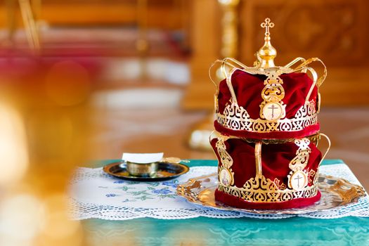 Bridal crowns. Sacral details of wedding ceremony in the Orthodox Christian Church. Russia.
