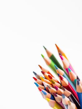 Bunch of colorful watercolor pencils on white background. School supplies. Kid's stationery with copy space. Back to school backdrop.