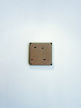 Central computer processor. CPU on light blue background. Technological detail of personal computer. Top view, flat lay.