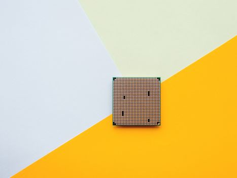 Central Computer Processor. CPU on geometric background. Colorful copy space. Technological detail of personal computer.